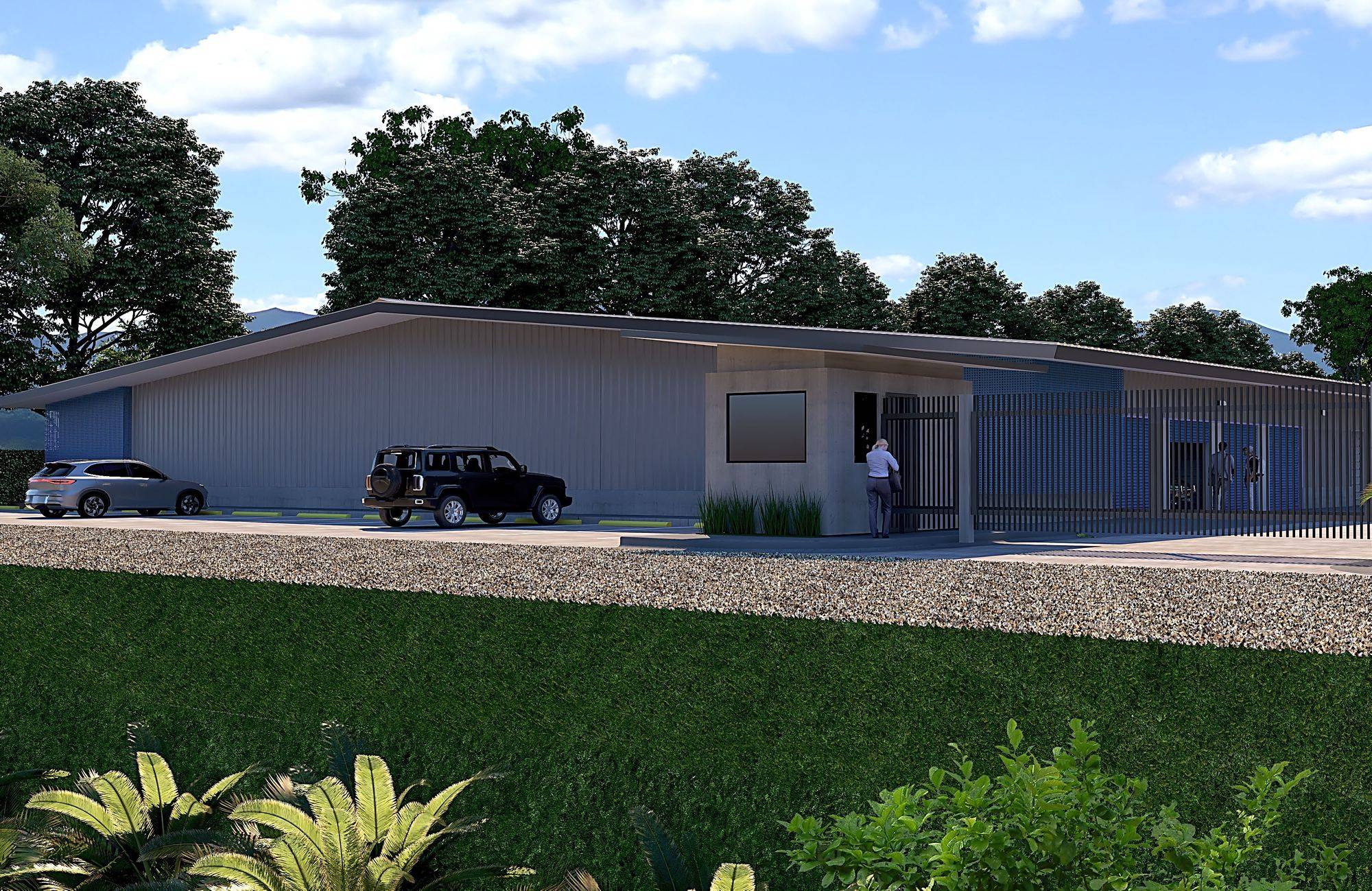 Street view of the facility entrance and guard house